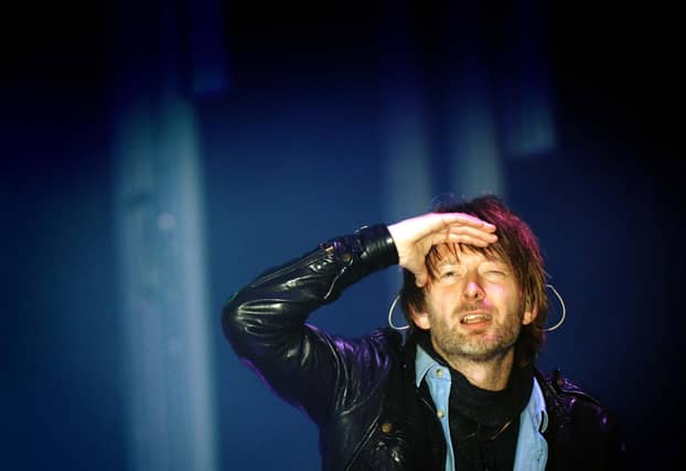 Thom Yorke the lead singer of Radiohead looks out from the main stage in 2009.