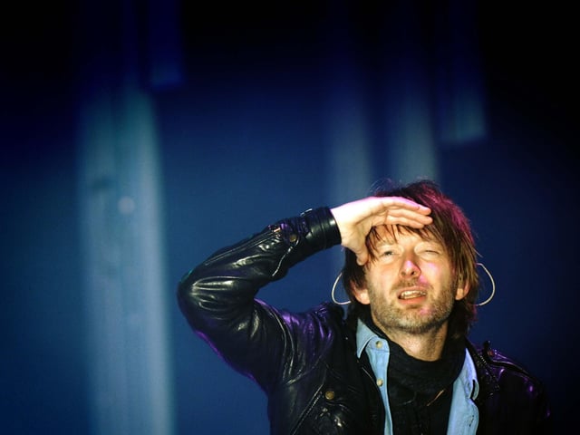 Thom Yorke the lead singer of Radiohead looks out from the main stage in 2009.