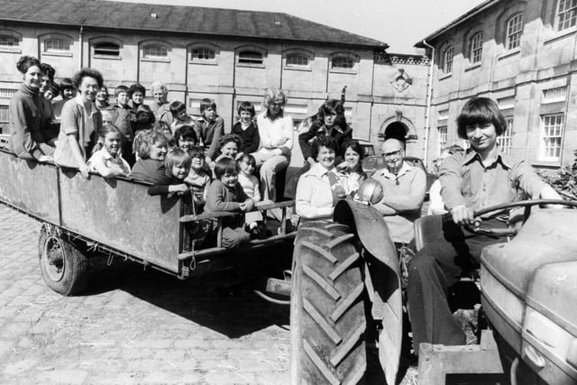 YEP Women's Circle members and their children had fun down on the farm when they visited Swillington House Farm in April 1976.  Driving the tractor is James Bulloack, whose father owns the farm.