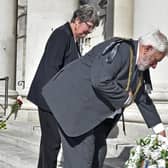 The Lord Mayor of Leeds, Coun Robert Gettings, lays the first flowers on the steps of Civic Hall. Picture: Steve Riding