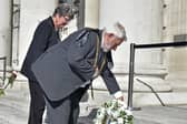 The Lord Mayor of Leeds, Coun Robert Gettings, lays the first flowers on the steps of Civic Hall. Picture: Steve Riding