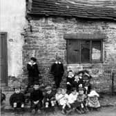 Children stand outside property adjoining no.14 Woodhouse Cliff in June 1913.