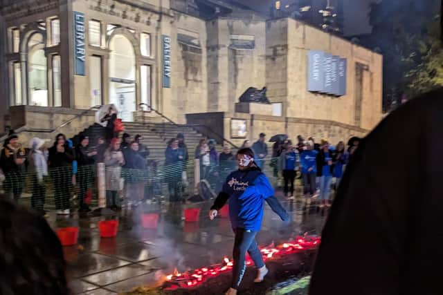 Fearless participants take to the coals in front of Leeds Art Gallery