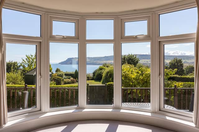 A bay window seat provides spectacular views across the sea.
