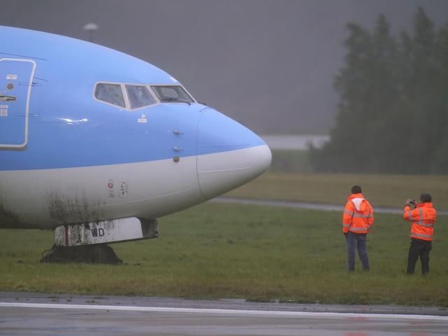 One witness said that after the plane came to a stop by the side of the runway alarms started going off in the airport