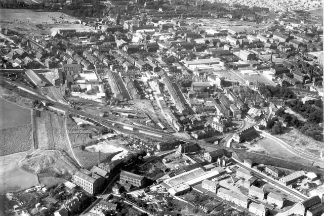 A bird's eye view of Morley in 1968. Housing, shopping and industrial areas are in focus. The Town Hall is visible in the distance.
