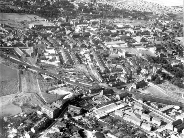 A bird's eye view of Morley in 1968. Housing, shopping and industrial areas are in focus. The Town Hall is visible in the distance.