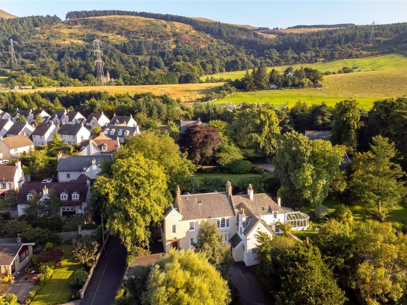 Aerial view of house and surrounding area.