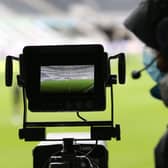 The pitch is seen through the lens of a TV camera at St James's Park, home of Newcastle United.