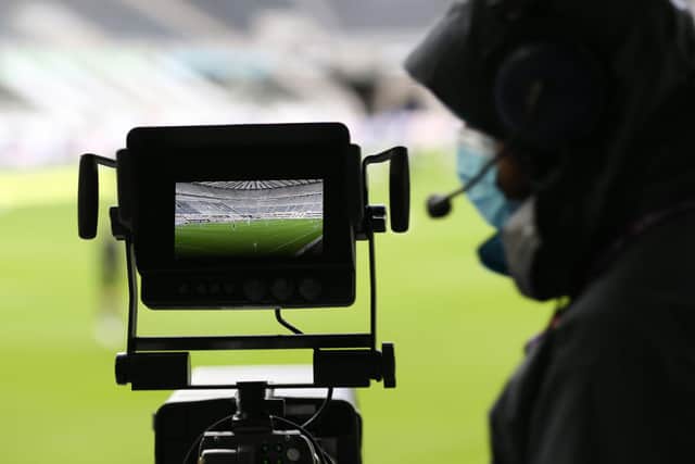The pitch is seen through the lens of a TV camera at St James's Park, home of Newcastle United.