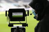 The pitch is seen through the lens of a TV camera at St James's Park, home of Newcastle United.