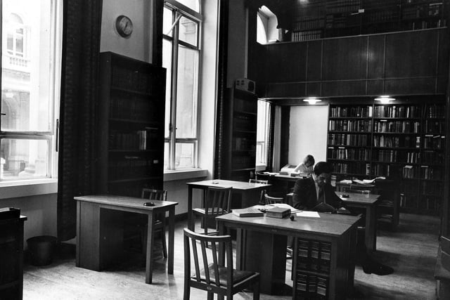 Law Library on the Calverley Street side of the Town Hall, overlooking the side entrance to the Central Library. Bookshelves line the walls with study desks and chairs situated in the centre. The Law Library was moved to the Combined Court on August 23, 1982.