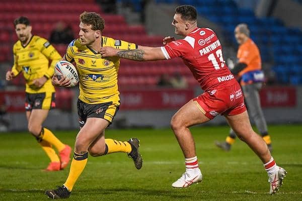 George Lawler is tackled by Oliver Partington during Tigers' defeat at Salford last week. Picture by Olly Hassell/SWpix.com.
