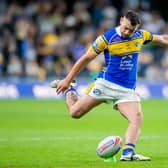Jake Connor kicks one of his eight conversions - from as many attempts - during Leeds Rhinos' 48-30 win against Leigh Leopards. Picture by Allan McKenzie/SWpix.com.