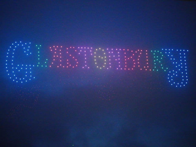 Festival goers watching a drone show at the Glastonbury Festival at Worthy Farm in Somerset. Picture date: Wednesday June 26, 2024. PA Photo. See PA story SHOWBIZ Glastonbury.