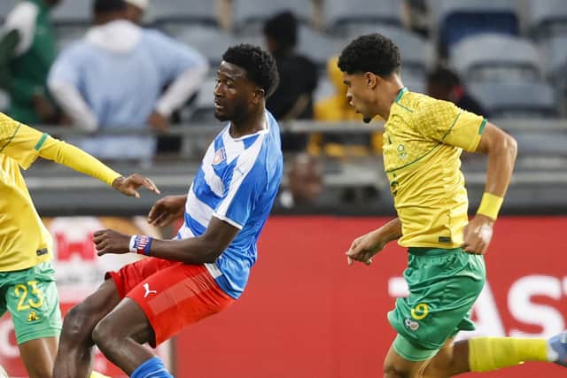 Kenneh (L) representing the country of his birth, Liberia, during an Africa Cup of Nations qualifier earlier this year. (Photo by PHILL MAGAKOE / AFP) (Photo by PHILL MAGAKOE/AFP via Getty Images)