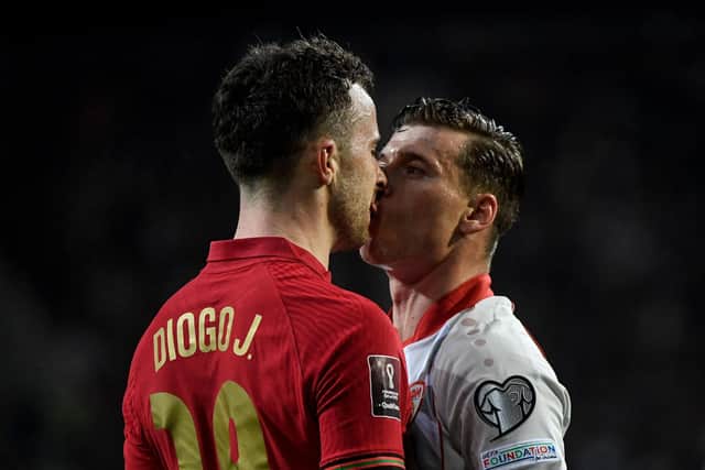 Portugal's forward Diogo Jota (L) and North Macedonia's midfielder Ezgjan Alioski argue during the World Cup 2022 qualifying final first leg football match between Portugal and North Macedonia (Photo by MIGUEL RIOPA / AFP) (Photo by MIGUEL RIOPA/AFP via Getty Images)