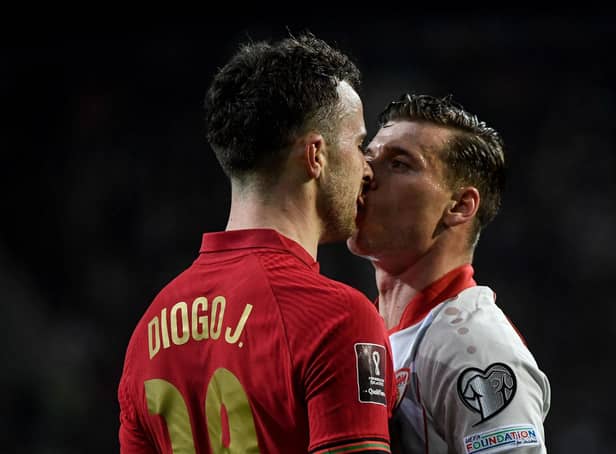 Portugal's forward Diogo Jota (L) and North Macedonia's midfielder Ezgjan Alioski argue during the World Cup 2022 qualifying final first leg football match between Portugal and North Macedonia (Photo by MIGUEL RIOPA / AFP) (Photo by MIGUEL RIOPA/AFP via Getty Images)