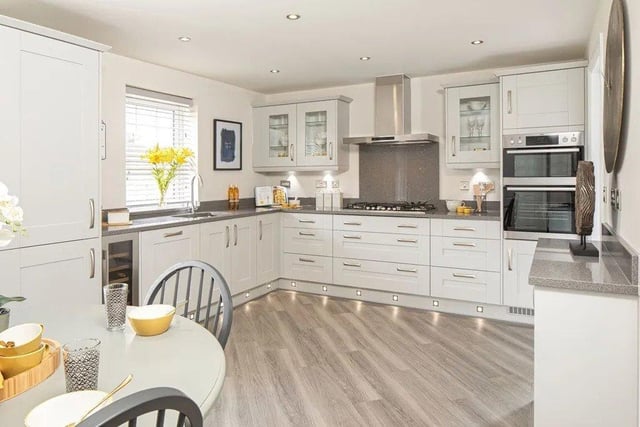 The home features an open-plan dining kitchen and separate dining room, both with french doors to a fully turfed garden.
