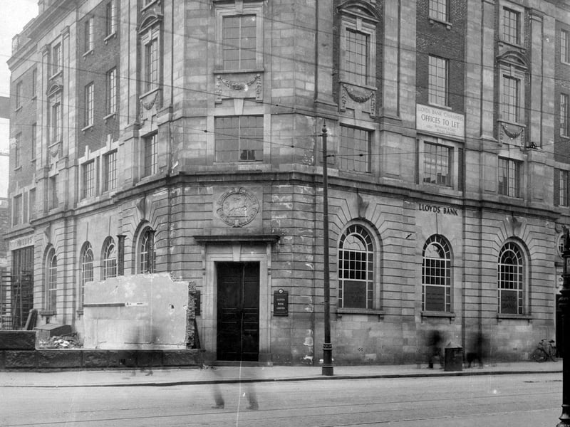 Lloyds Bank on junction of Vicar Lane with The Headrow, taken during road widening in July 1931. Phillip's Jewellers can be seen on the left.