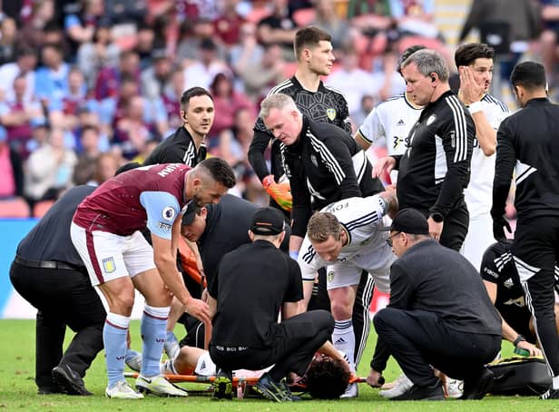 ANXIOUS MOMENT - Aston Villa's John McGinn checks on Leeds United teenager Archie Gray during the pre-season friendly in Brisbane. Gray's injury turned out to be minor. Pic: Getty