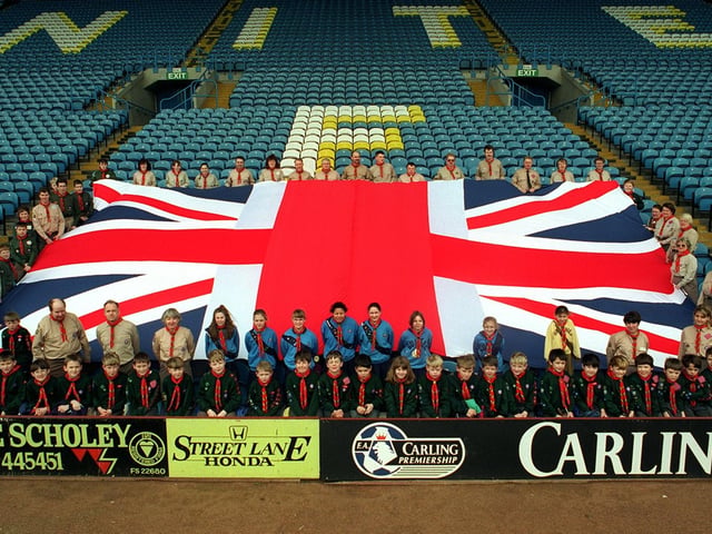Scouts and leaders representing the 80 strong cast of Central Yorkshire Scouts 1996 Gang Show unite at Elland Road and parade a giant Union Jack flag.