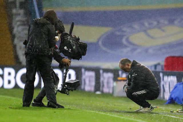 Marcelo Bielsa, manager of Leeds United, is filmed by the TV camera as he takes a moment following the Premier League match between Leeds United and Manchester City at Elland Road on October 3, 2020.