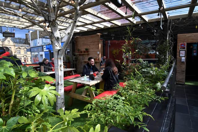 The popular bar also does food, including wood-fired pizza.