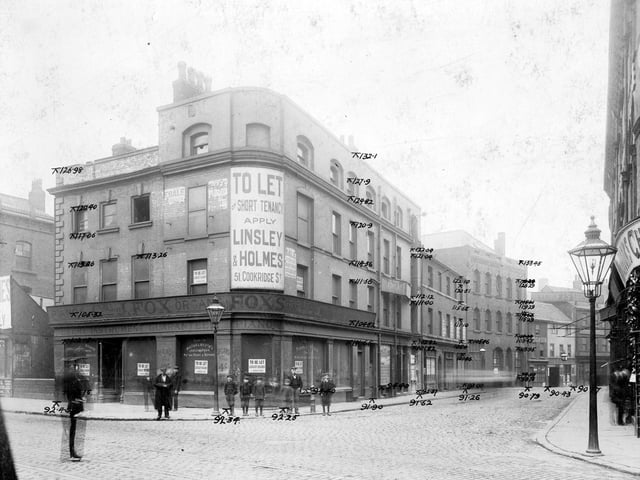 The junction of Swinegate and Sovereign Street in August 1904. On the corner, J. Fox musical instruments shop has 'To Let' signs. On Swinegate, towards, the right, can be seen Ye Olde Dustye Miller Inn at number 9, landlord William Jackson. Next on the right, number 10, was Thomas Beecroft & Co Electroplaters and engineers.