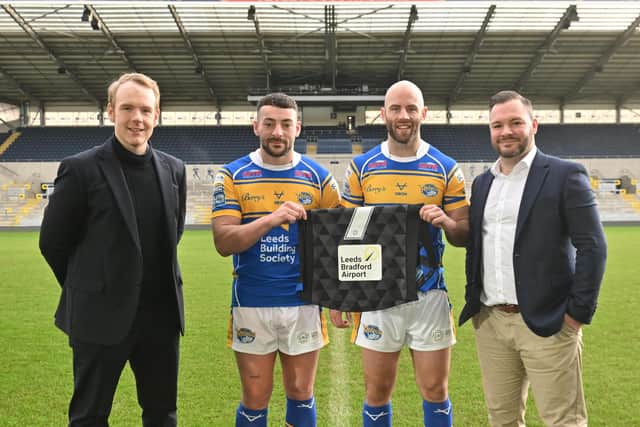Rhinos players Jake Connor and Matt Frawley celebrate the new partnership with leeds Bradford Airport. Picture by Matthew Merrick/Leeds Rhinos.