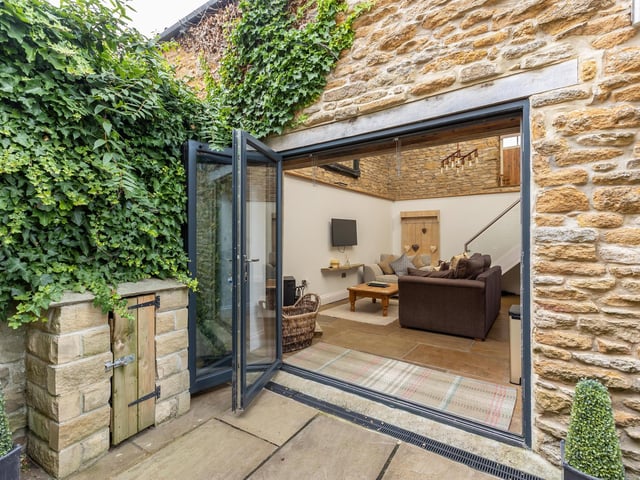 From outside in, to the stone built annexe.