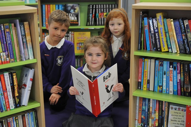 James McFadyen, Ella Barron and Ella Gibson in their new school library 5 years ago.
