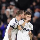 LEEDS, ENGLAND - JANUARY 04: Mateusz Klich (R) of Leeds United is embraced by teammate Liam Cooper following his team's draw in the Premier League match between Leeds United and West Ham United at Elland Road on January 04, 2023 in Leeds, England. (Photo by George Wood/Getty Images)