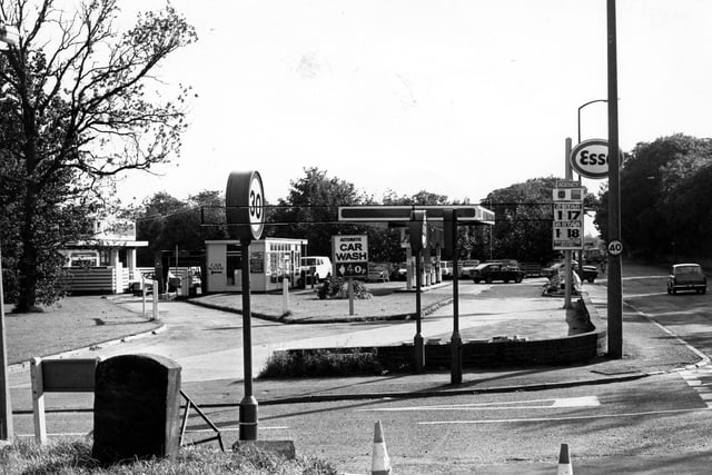 St.Helens Lane of Lawnswood petrol filling station, with Otley Road running along on the right. An automatic car wash is advertised for 40p. Pictured in September 1979.
