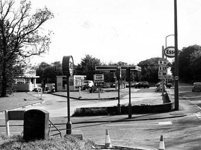 St.Helens Lane of Lawnswood petrol filling station, with Otley Road running along on the right. An automatic car wash is advertised for 40p. Pictured in September 1979.