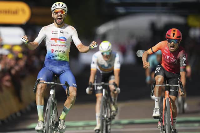 WINNER: Anthony Turgis celebrates as he crosses the finish line in Troyes ahead of Leeds's Tom Pidcock, right, seen screaming in disappointment, in the ninth stage of the Tour de France Picture: AP/Daniel Cole