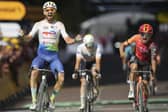 WINNER: Anthony Turgis celebrates as he crosses the finish line in Troyes ahead of Leeds's Tom Pidcock, right, seen screaming in disappointment, in the ninth stage of the Tour de France Picture: AP/Daniel Cole