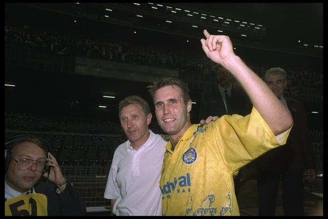 1992:  Howard Wilkinson (left) Manager of Leeds and Carl Shutt (right) of Leeds celebrate after winning the European Cup first round replay match against Stuttgart in Barcelona, Spain. Leeds won the match 2-1. \ Mandatory Credit: Allsport UK /Allsport