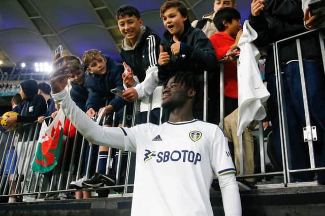 PERTH, AUSTRALIA - JULY 22: Darko Gyabi of Leeds United takes a selfie with the supporters during the Pre-Season friendly match between Leeds United and Crystal Palace at Optus Stadium on July 22, 2022 in Perth, Australia. (Photo by James Worsfold/Getty Images)