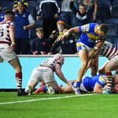 Harry Newman scores Rhinos' fifth try against Wigan. Picture by Jonathan Gawthorpe.