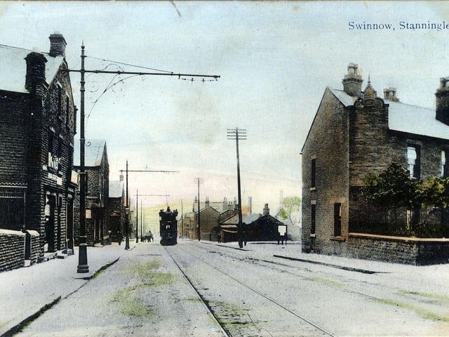 A colour-tinted postcard of Stanningley Road at Swinnow with a postal date of April 20, 1911. On the right is a row of back-to-back houses with Gladstone Terrace on the near side and Bright Street on the far side. On the left is the junction with Harrison's Avenue.