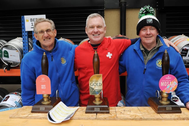 Local rotary club members Steve McGrail and Tim Capstick were joined for a shift behind the bar by Chris Eaborn, centre. A member of the Rotary Club Lausanne in Switzerland, his son went to Leeds Grammar School.