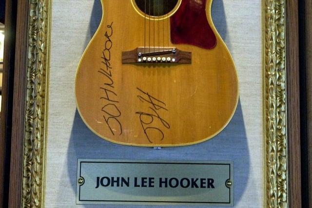 A guitar signed by music legend Jon Lee Hooker adorned the walls.