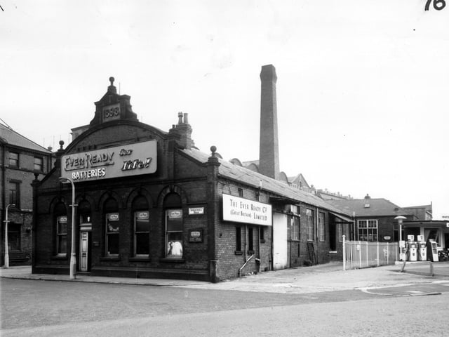 industrial premises on Springwell Road pictured in March 1965. Built in 1898, this property was originally used by T. Batt and Co, oil and tallow merchants and grease manufactures. At the time of this view it was a warehouse and office for the Ever Ready Battery Co. On the right, BP petrol pumps can be seen at the Whitehall Service Station.