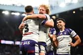 Lachlan Walmsley, centre of picture, celebrates with Cam Scott, left, after the latter's try for Wakefield Trinity in the Grand Final win against Warrington Wolves. Picture by Olly Hassell/SWpix.com.