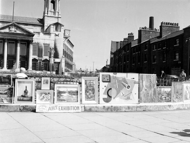A summer exhibition of paintings held around the gardens in front of the Civic Hall on July 13, 1967. The paintings are the work of Leeds Painting and Sketching Club and feature landscapes, still life and abstract works. The club met at the Leeds Civic Arts Guild at 43 Cookridge Street, on a weekly basis. Leeds Civic Hall is in the background, left.