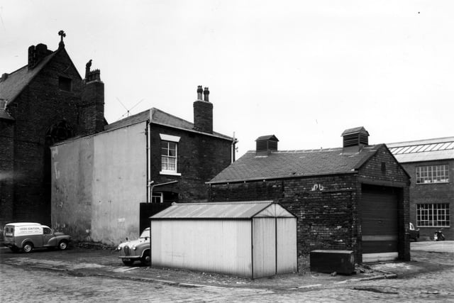 Sowerby Street in March 1965. On the left edge of this view is the Gainsborough Cinema which was converted from a Unitarian Chapel in 1931. This view was taken shortly before the cinema closed in 1966. Moving right is the back of the Rising Sun public house with a Leeds Ignition van parked behind.