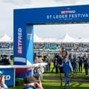 Over 26,000 racegoers attended the flagship day of the Betfred St Leger Festival to witness a historic win from Tom Marquand, riding Scandinavia