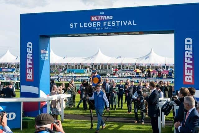 Over 26,000 racegoers attended the flagship day of the Betfred St Leger Festival to witness a historic win from Tom Marquand, riding Scandinavia