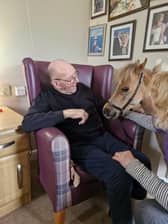 Resident from HC-One’s Newfield Lodge Care Home with Hazle, a therapeutic miniature American horse from KL Pony Therapy